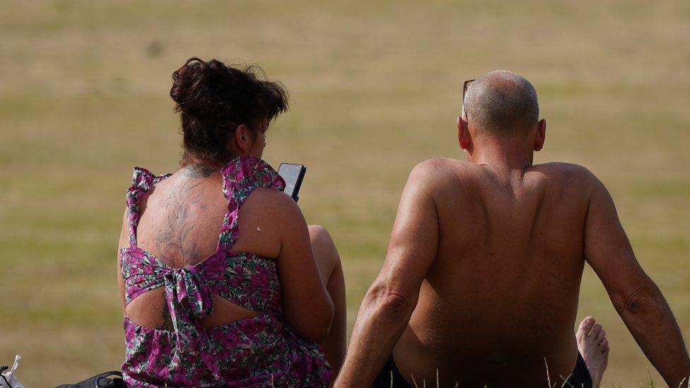 People sunbathing