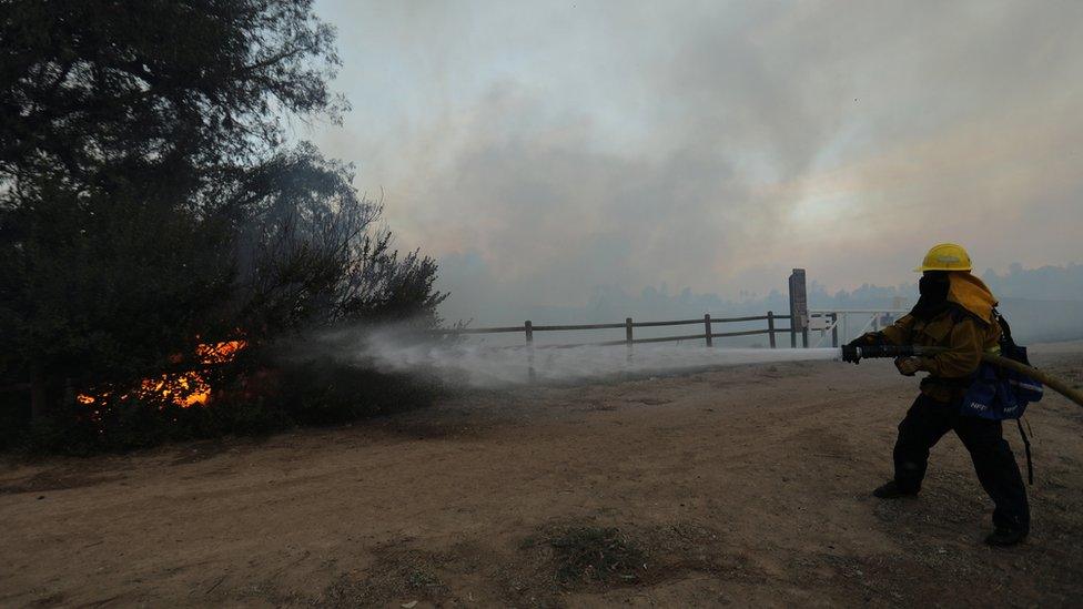 Fire fighter trying to put out fire