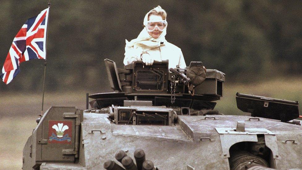 Margaret Thatcher stands in a British tank during a visit to British forces in Fallingbostel, Germany, 1986