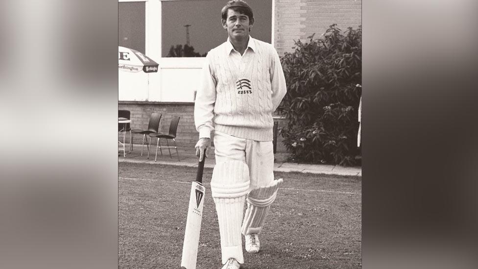 Robin Hobbs playing cricket and holding a cricket bat