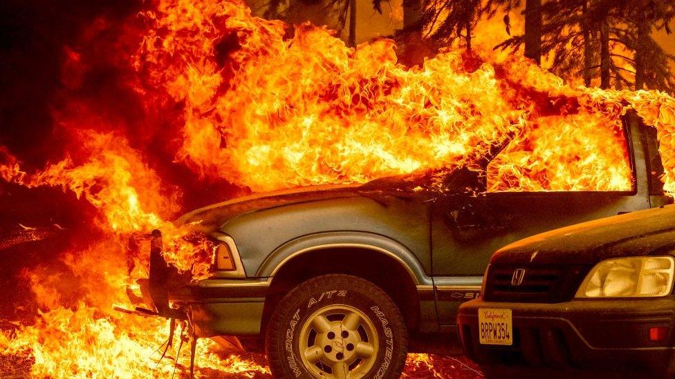 The Dixie Fire burns a car