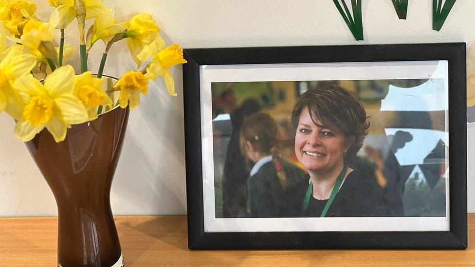 A framed picture of Ruth Perry