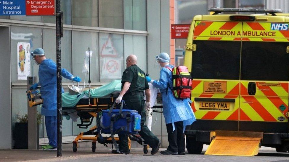 Doctors transport a patient from an ambulance to the Royal London Hospital