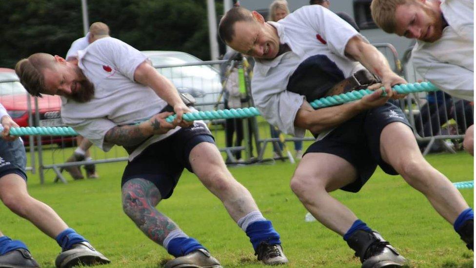 two men taking part in tug of war