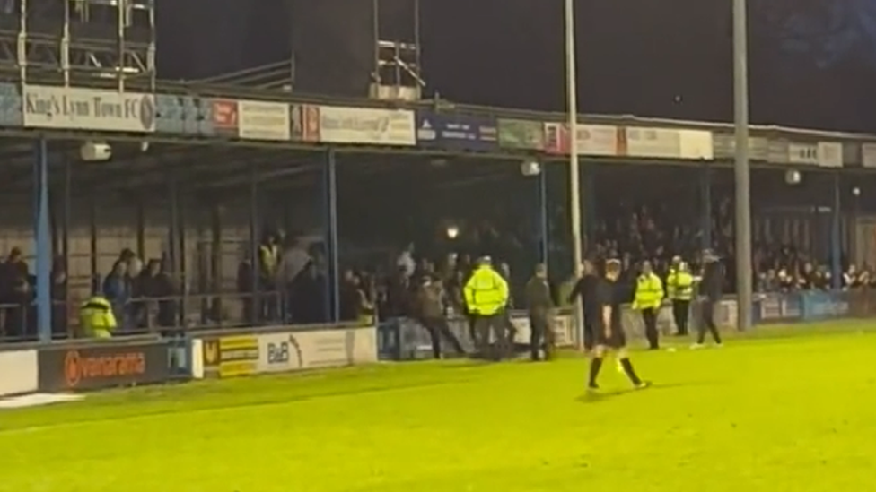 Fans appearing to fight at the King's Lynn Town FC vs Boston United match