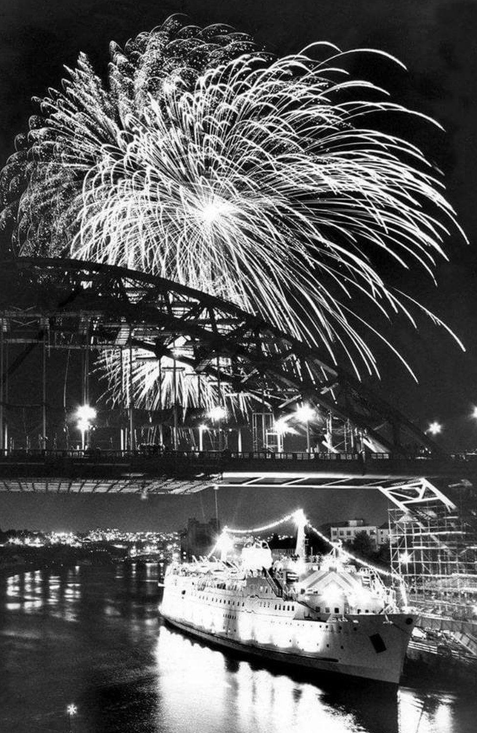 Tuxedo Royale moored below the Tyne Bridge as fireworks explode overheard