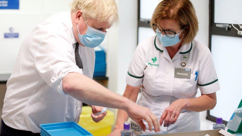 Boris Johnson with advanced pharmacy technician Jane Hosea at a vaccine centre in Northampton