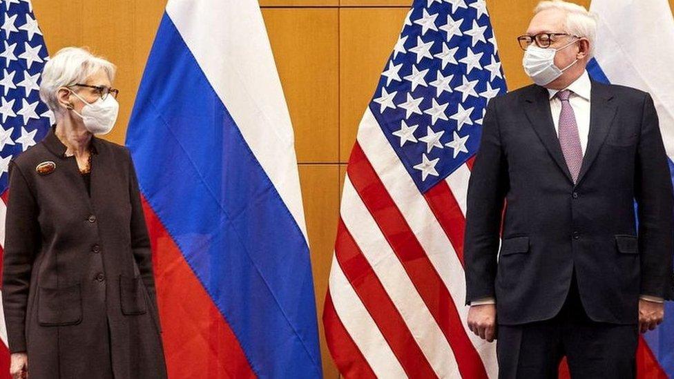 US Deputy Secretary of State Wendy Sherman (L) and Russian deputy Foreign Minister Sergei Ryabkov (R) pose for pictures as they attend security talks on soaring tensions over Ukraine, at the US permanent Mission, in Geneva, on January 10, 2022