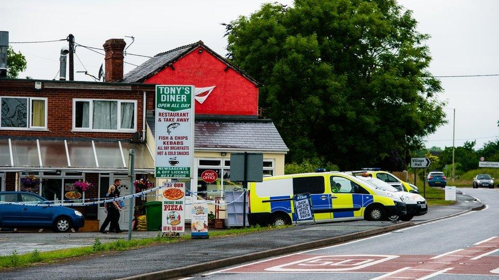 Police outside the cafe in Halfway House