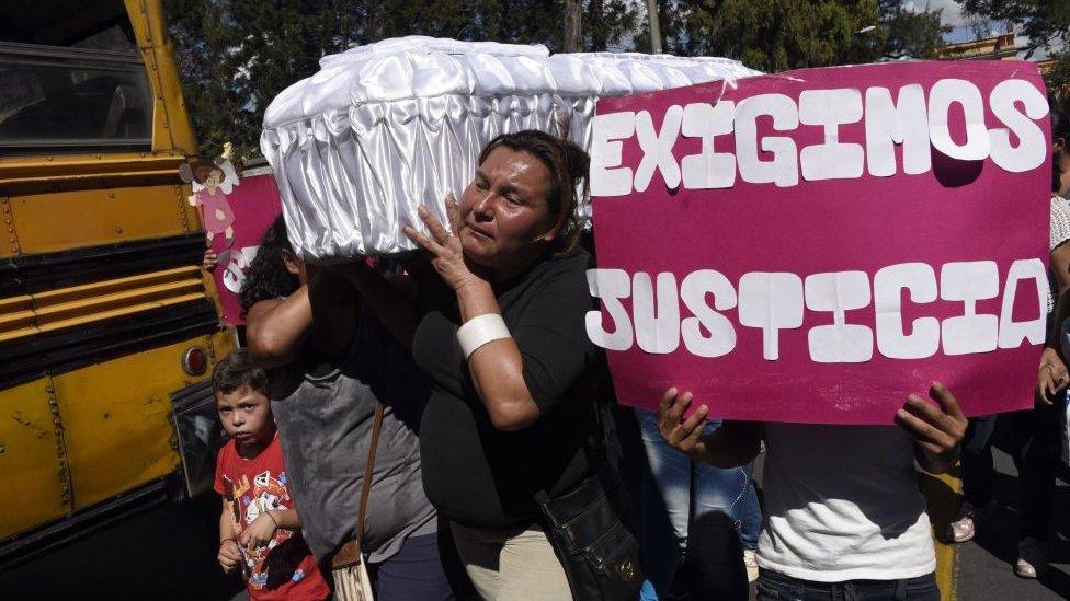 Relatives and friends carry the coffin of 17-year-old Siona Hernandez, who died in a fire at a state-run shelter, during her funeral at the general cemetery in Guatemala City on March 10, 2017.