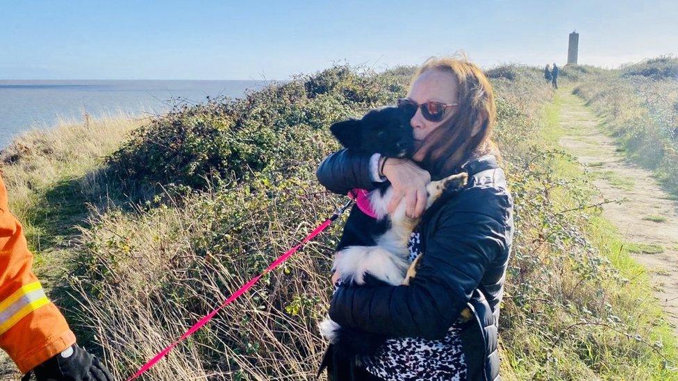 Woman with dog at Walton-on-the-Naze clifftop