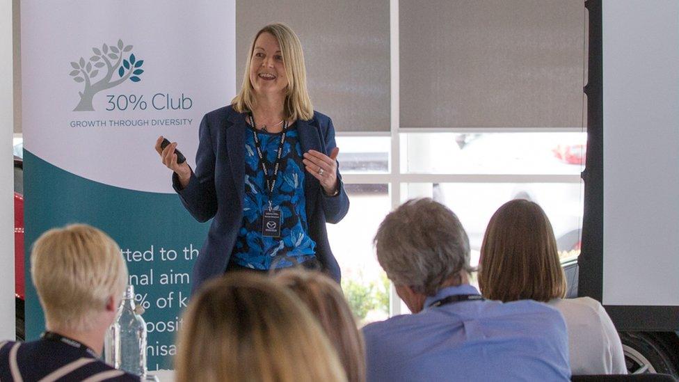 Julianne Miles speaking at an event