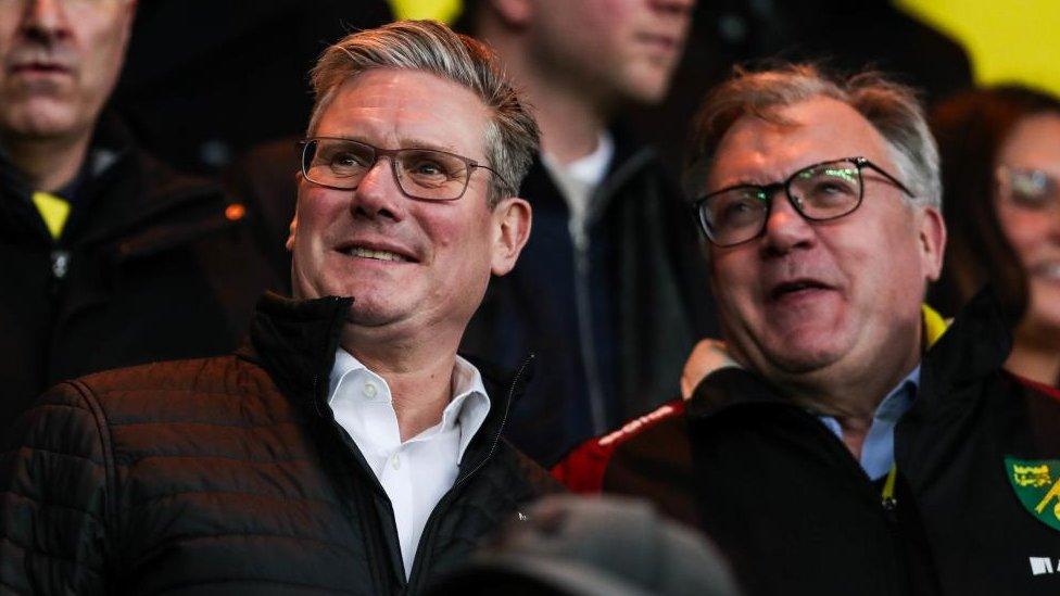 Two men in a football stand