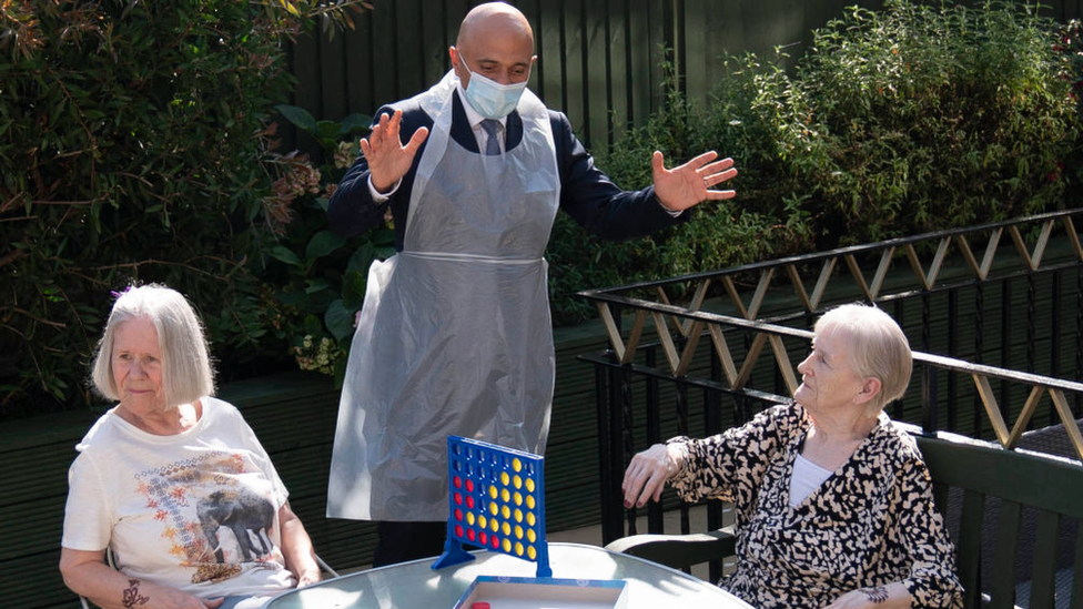 Sajid Javid speaks with residents as he visits Westport Care Home in east London