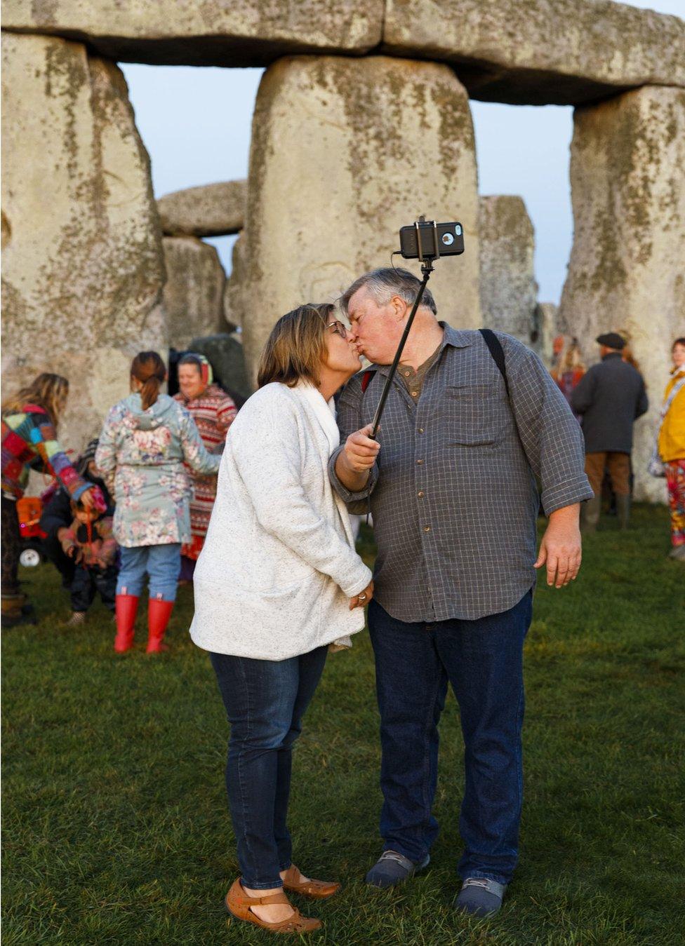 Couple taking a selfie while kissing