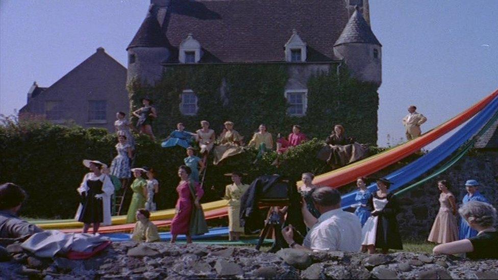 Cyril Lord posing with models at Ballygally Castle near Larne