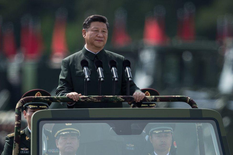 China's President Xi Jinping inspects People's Liberation Army soldiers at a barracks in Hong Kong on 30 June 2017.