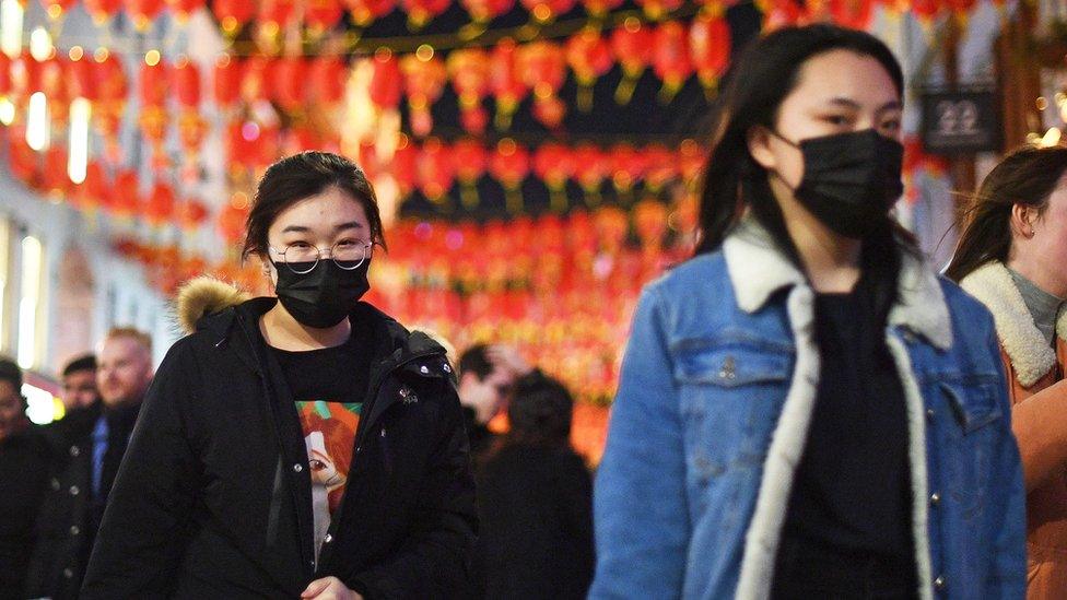 People wearing masks in Chinatown