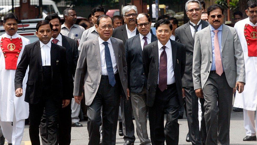 Former Indian Chief Justices Dipak Misra and Ranjan Gogoi with other judges at an event in 2018