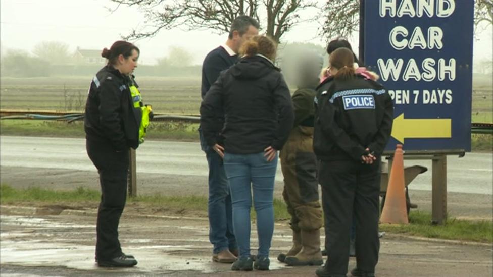 Police arresting man