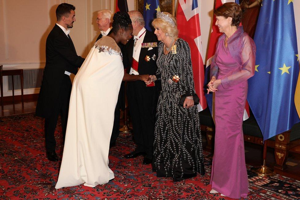 German President Frank-Walter Steinmeier, Britain's King Charles III, Camilla, Queen Consort and First Lady Elke Buedenbender greet Evgenij Voznyuk and Motsi Mabuse during a state banquet defilee at Schloss Bellevue presidential palace in Berlin