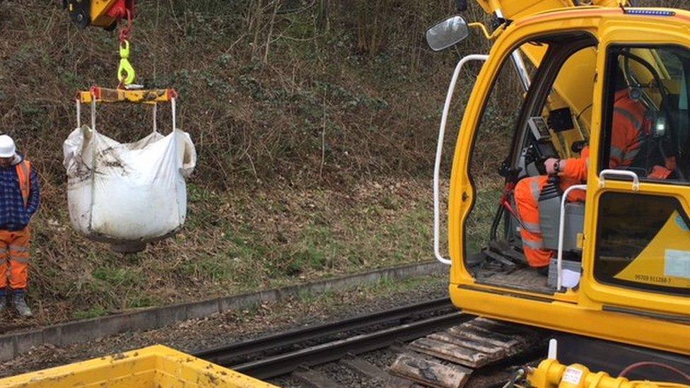 Network Rail staff working to clear the track