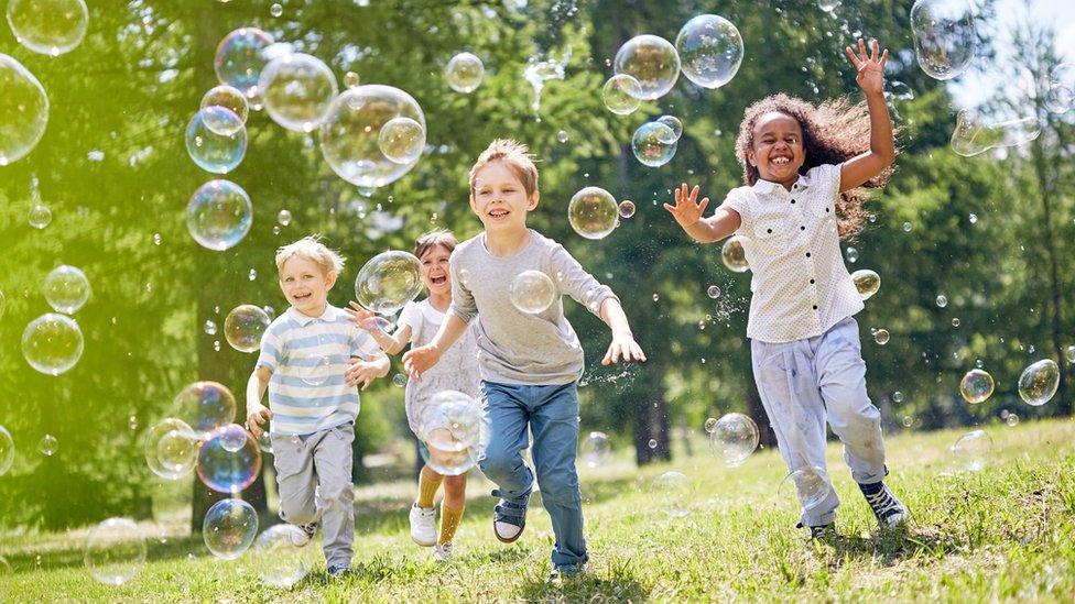 kids playing in the bubbles