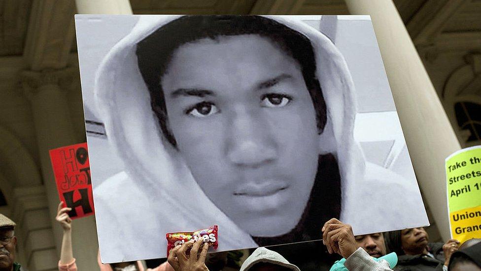 A protester holds up a photo of Trayvon Martin in New York City.