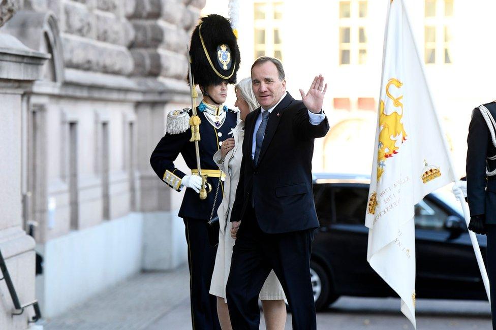 Swedish Prime Minister Stefan Lofven and his wife Ulla arrive at the Swedish parliament, 25 September