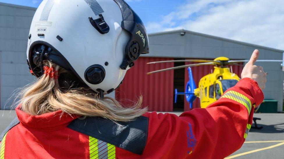 Air Ambulance critical care paramedic wearing a flight helmet