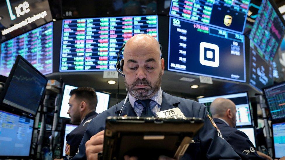 Traders work on the floor of the New York Stock Exchange (NYSE) in New York, U.S., November 7, 2018.