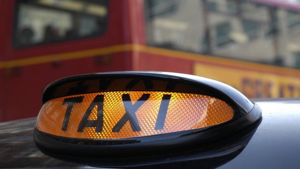 Black cab and London bus