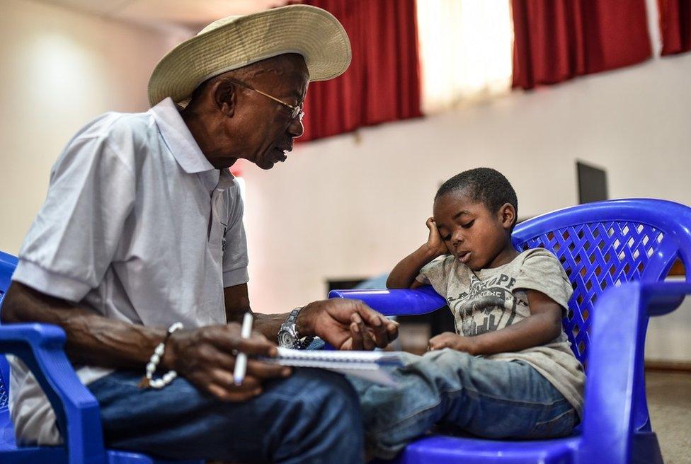 Man talking to a child