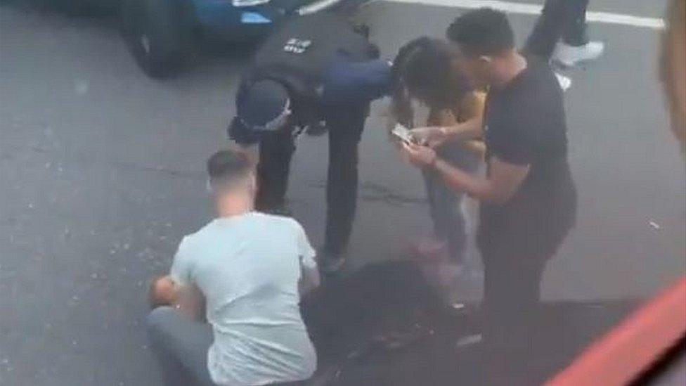 Lady rescued from being trapped between cars