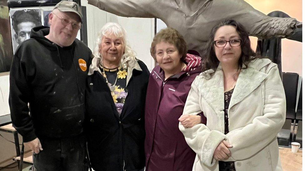 Andy Edwards with Lyn, Lesley and Gill in front of the sculpture