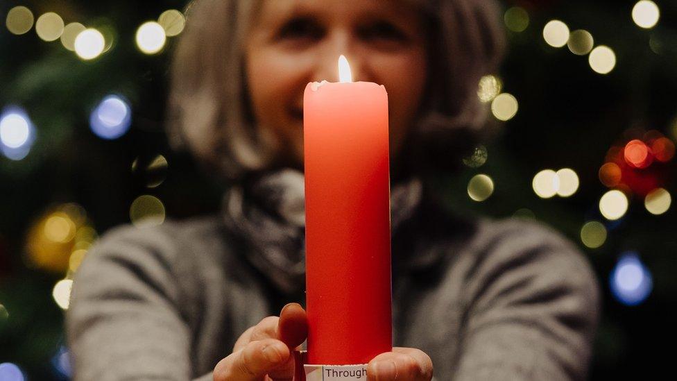 Woman holding a candle