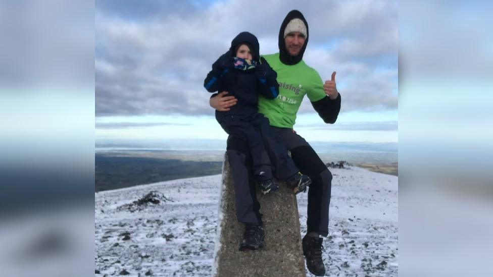 Oscar and Matt Burrow at mountain summit