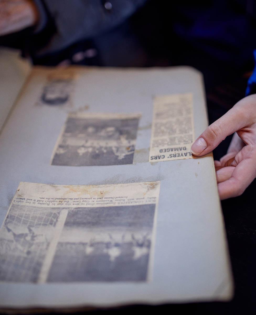 Bury fan looking through a scrapbook