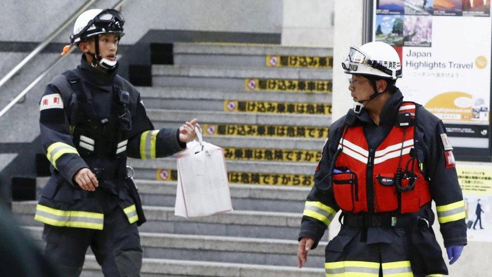 Rescue workers at Odawara station after a Japanese Shinkansen bullet train made an emergency stop on its way from Tokyo to the western city of Osaka due to a man holding an edged tool attacked passengers, Japan, 9 June 2018