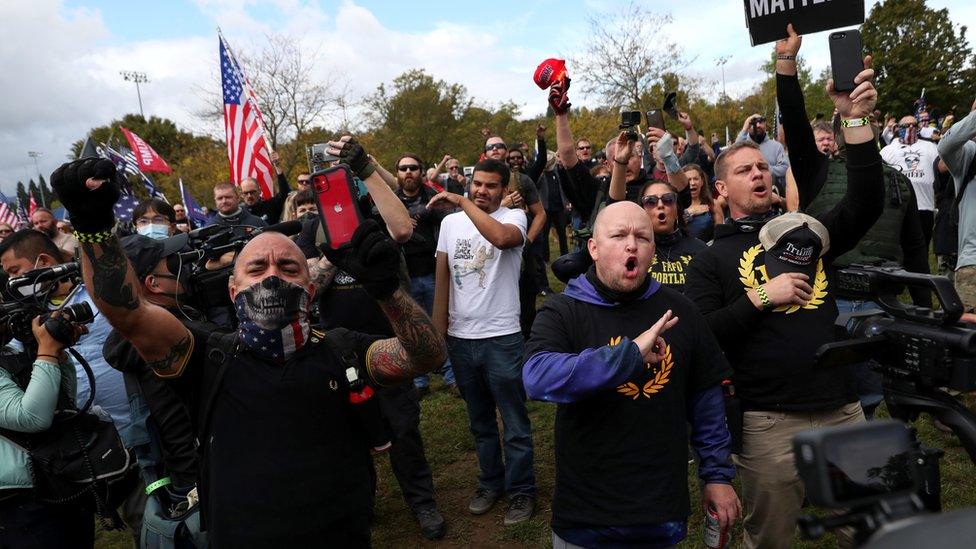 People gesture and shout slogans during a rally of the far right group Proud Boys, in Portland, Oregon, 26 September, 2020.