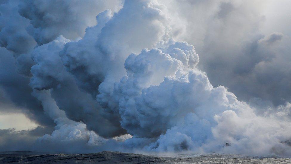 Lava flows into the Pacific Ocean southeast of Pahoa during ongoing eruptions of the Kilauea Volcano in Hawaii, US, May 20, 2018