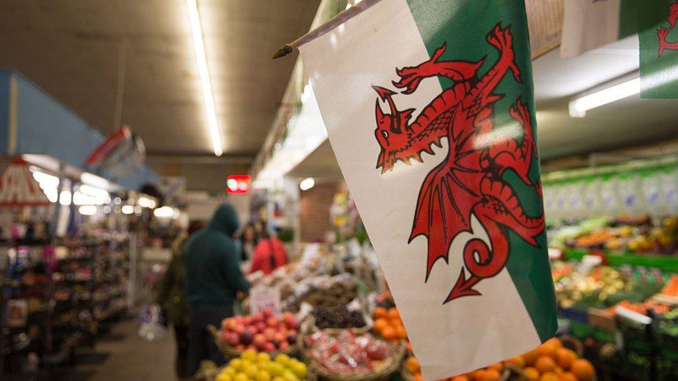 A Welsh flag is displayed in the market in Aberdare