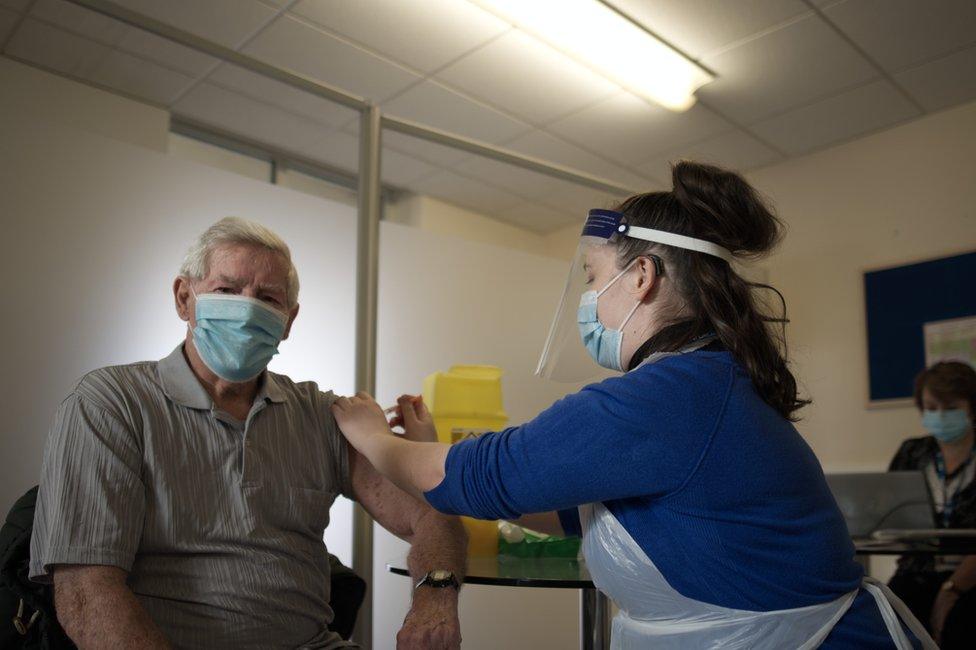 Dennis receiving his vaccine