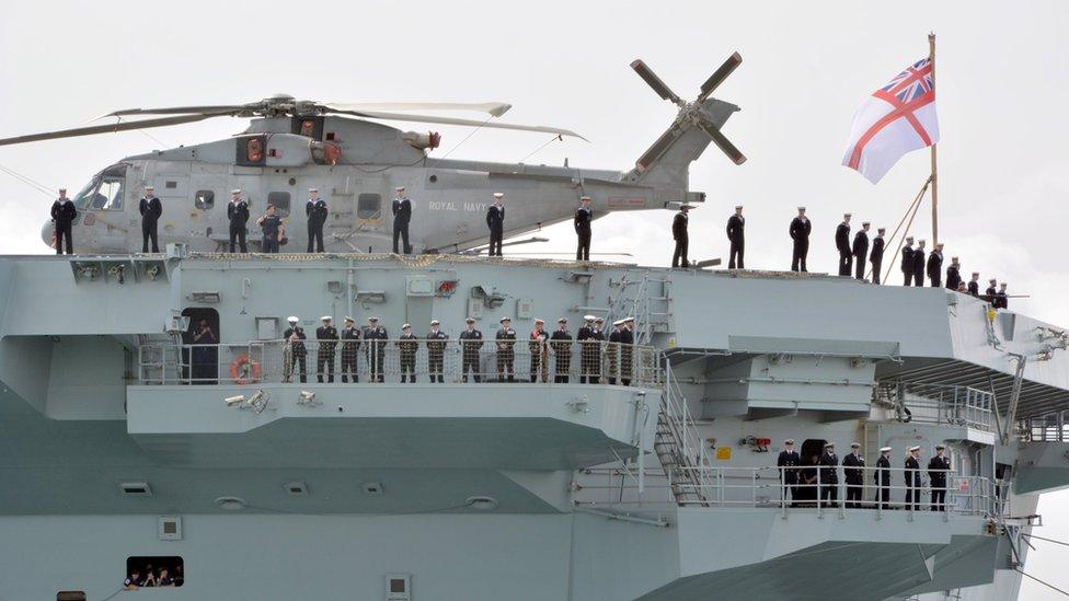 Personnel lining the deck of HMS Prince of Wales