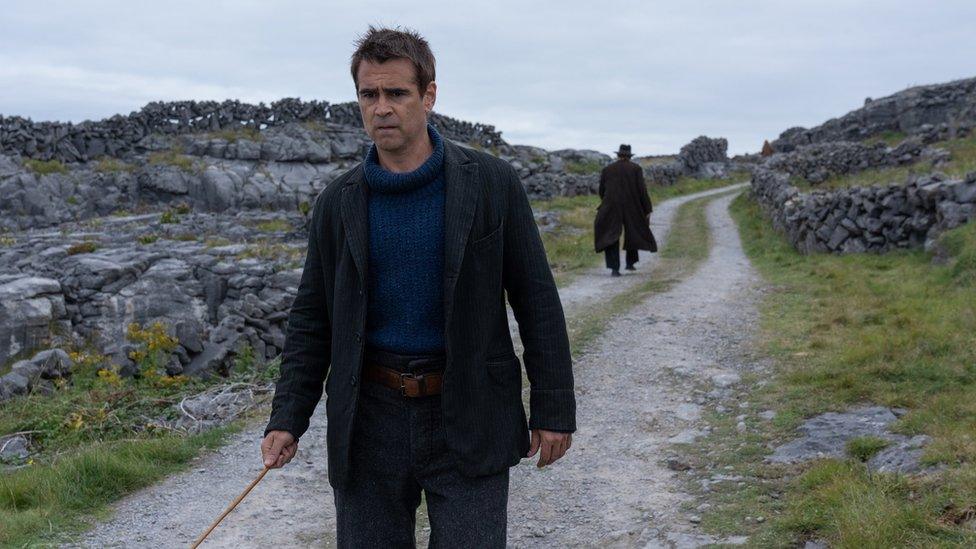 Colin Farrell wearing blue polo neck jumper