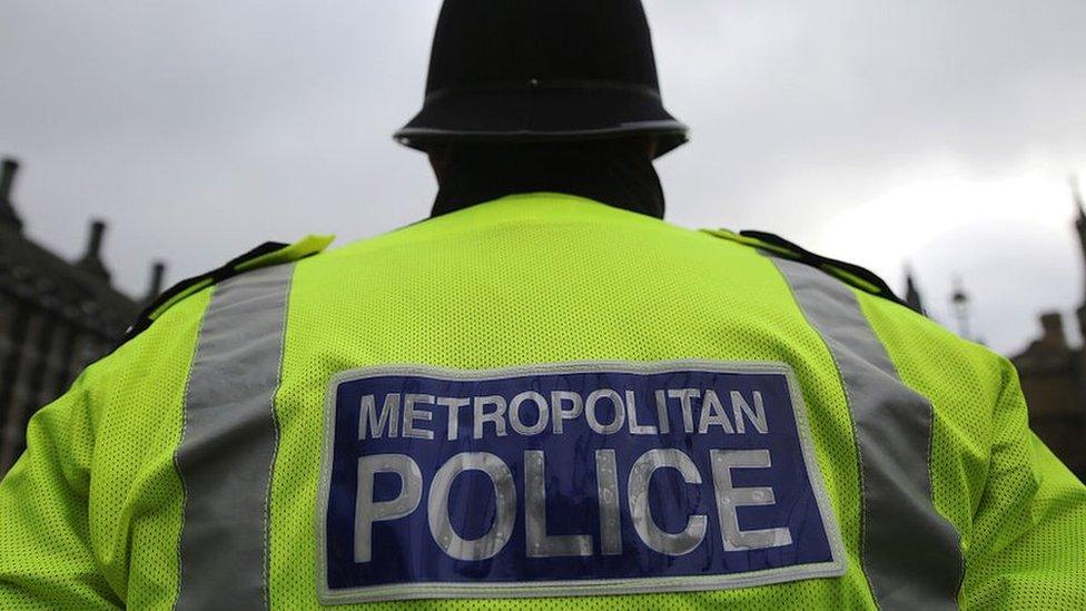 Met Police officer outside Houses of Parliament