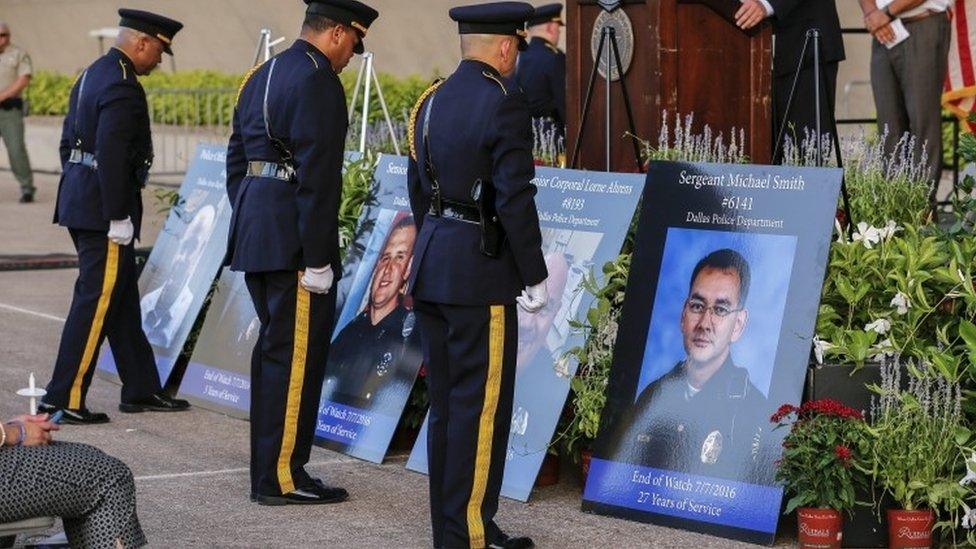 Honour guards by portraits of killed officers