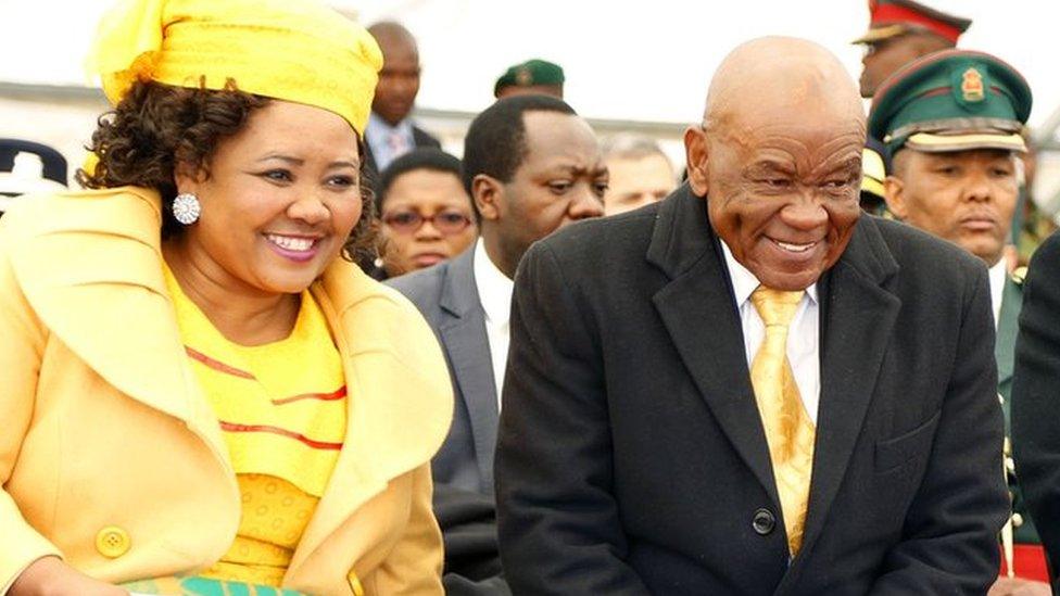 Newly appointed Lesotho prime Minister Thomas Thabane (C), leader of the All Basotho Convention (ABC) political party, his wife "Ma Isaiah Ramoholi Thabane (L) and Lesotho King Letsie III (R) react during Thabane"s inauguration on June 16, 2017 in Maseru