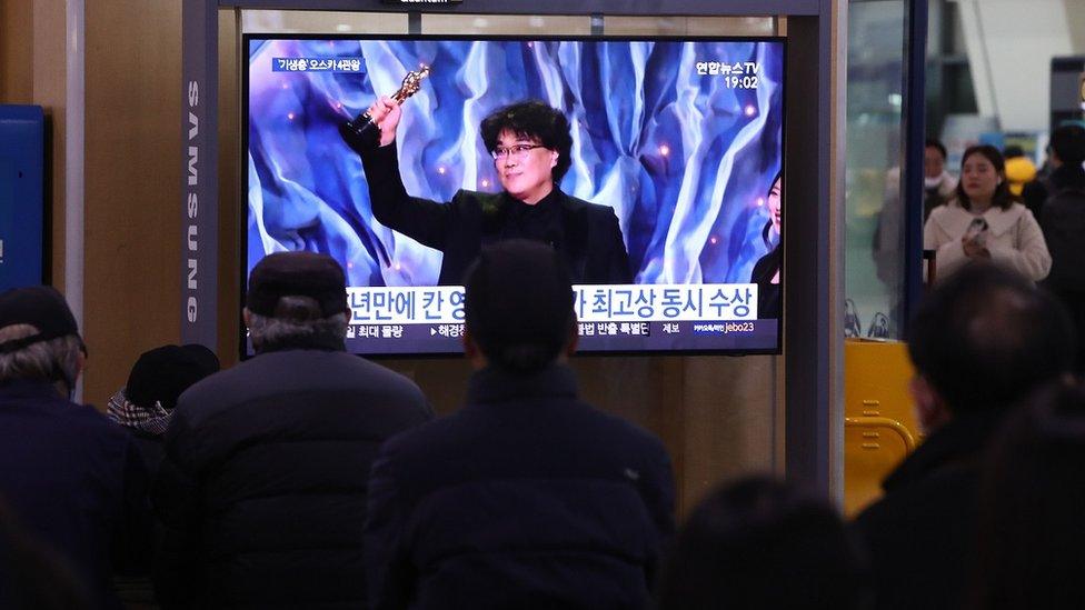 A tv screen in South Korea shows director Bong Joon-ho