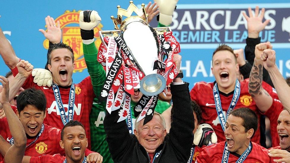 Manchester United manager Sir Alex Ferguson lifts the Barclays Premier League trophy after the Barclays Premier League match at Old Trafford, Manchester.